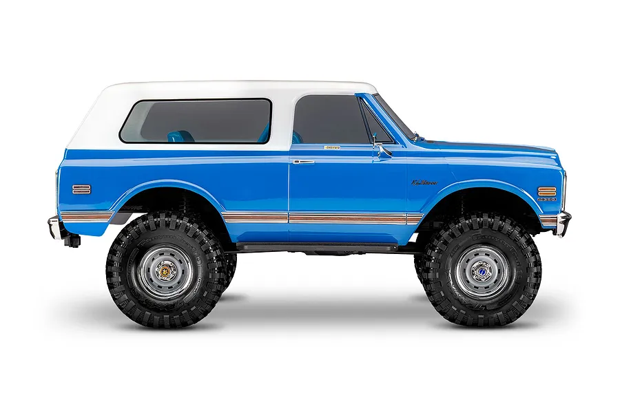 Studio side profile shot of the Traxxas TRX-4 Chevrolet Blazer RC rock crawler in blue with a white removable hardtop.
