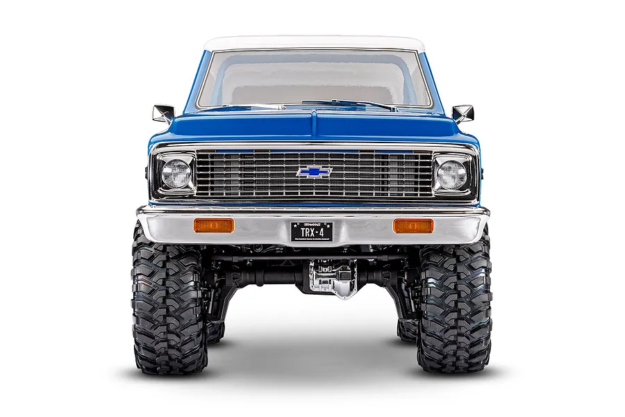 Front view of the Traxxas TRX-4 Chevrolet Blazer RC rock crawler showcasing its blue body, white roof, and large tires.