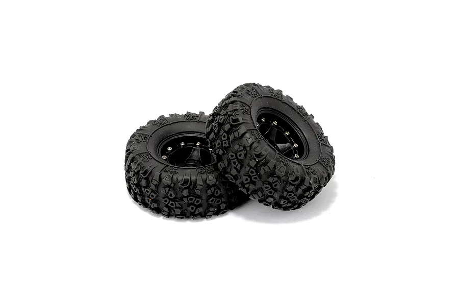 Two RGT 1/18 scale crawler tyres mounted on black rims with aggressive tread patterns against a white background.