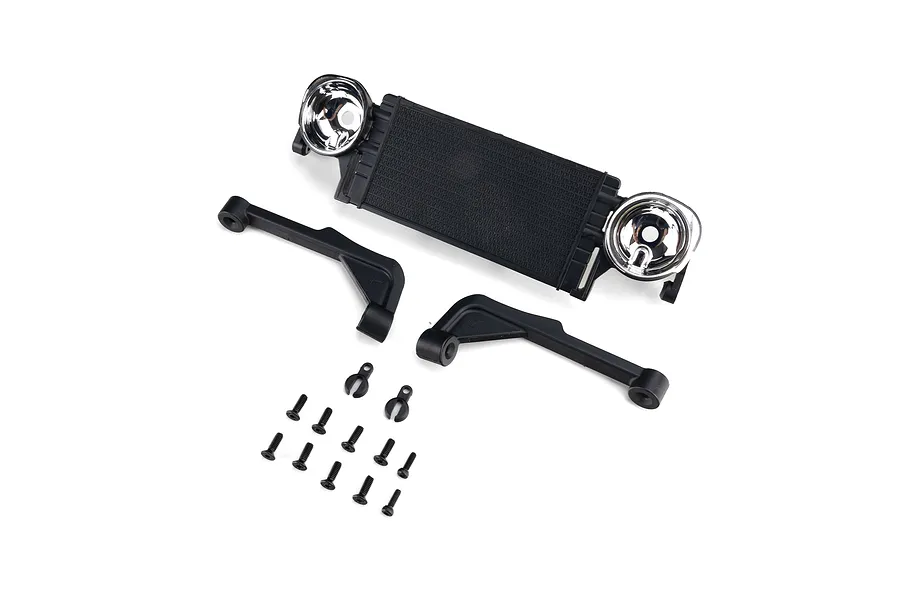 Axial front radiator and light buckets set with brackets and hardware laid out on a white background.