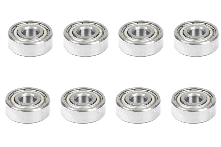 Eight metal shielded ball bearings arranged in two rows of four against a clean white background.
