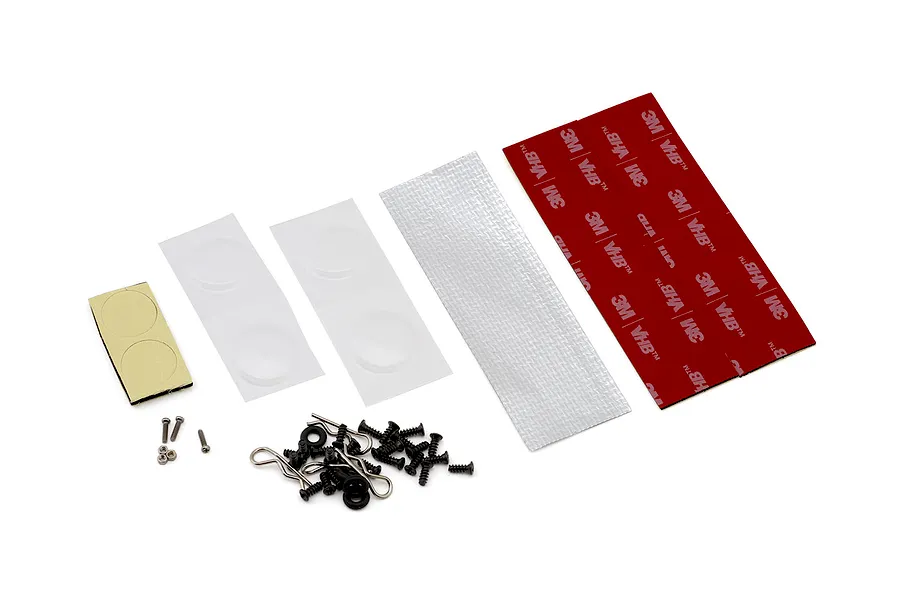 RC car body accessories including double-sided 3M VHB tape, screws, clips, and mounting hardware on white background.