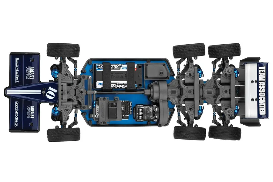 Top down view of the Team Associated RC10 6x6 RC car chassis showing its dual rear axle layout, blue chassis plate, and electronic components.