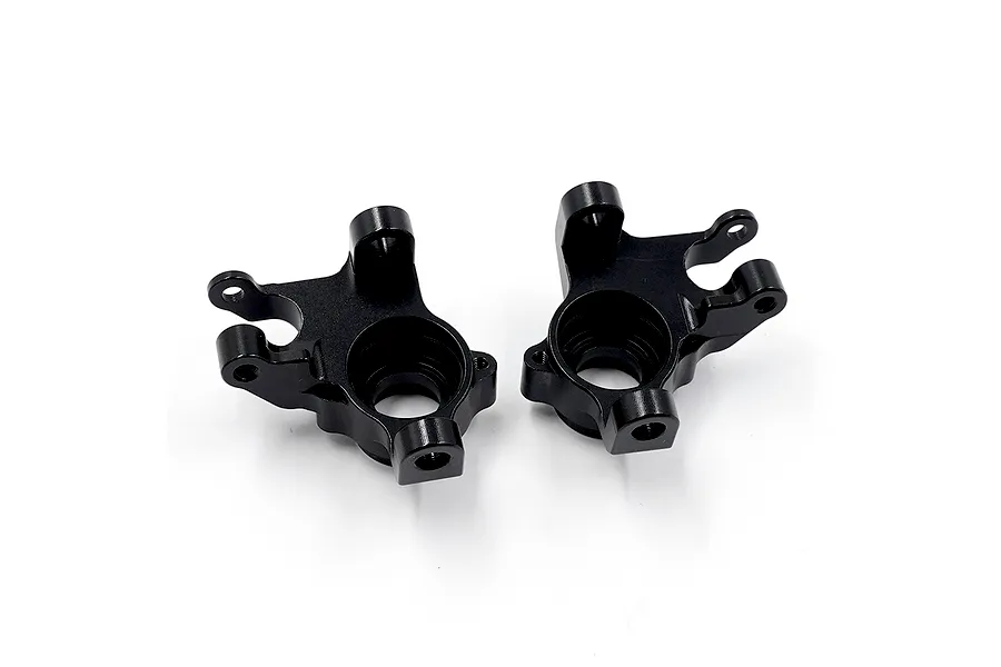 Two black anodised aluminium front steering hub carriers (C-hubs) shown from an angled top view on a plain white background.