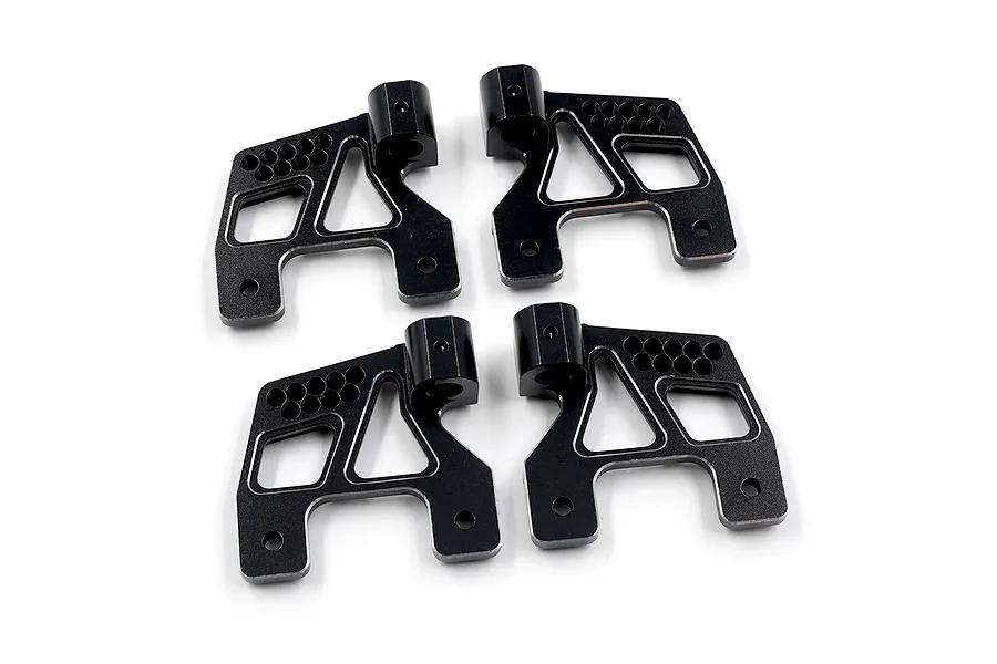 Four black anodized aluminium shock mount brackets with cutouts and multiple mounting holes, viewed from above.
