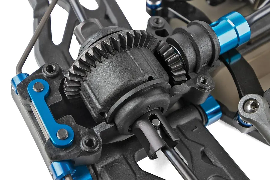 Close-up studio shot of the internal differential and gear assembly on the Team Associated RC10B84.1 RC buggy chassis.