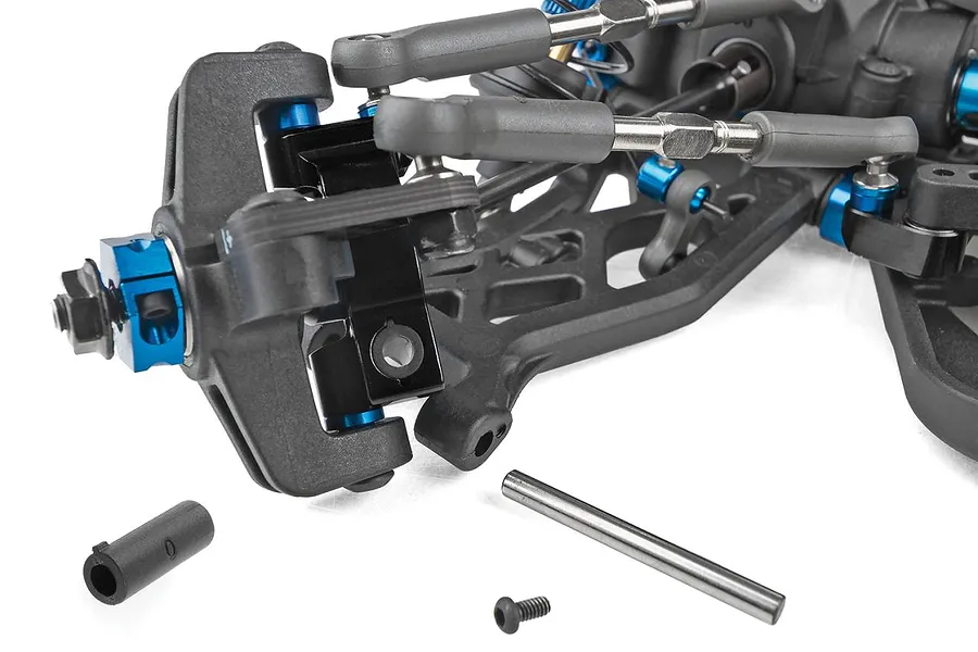 Close-up studio view of the front suspension and steering assembly on a Team Associated 1/10 scale RC buggy.
