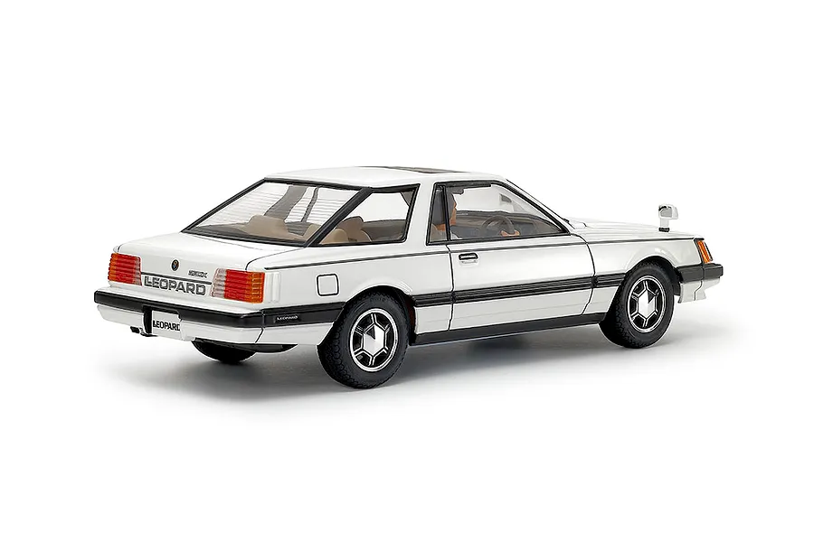 Rear three-quarter view of the Tamiya 1/24 Nissan Leopard 280X plastic model car kit finished in white against a clean white background.