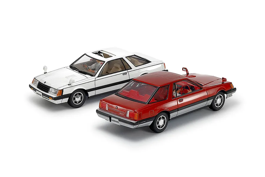 Two completed 1/24 scale Tamiya Nissan Leopard model cars in white and red against a white background.