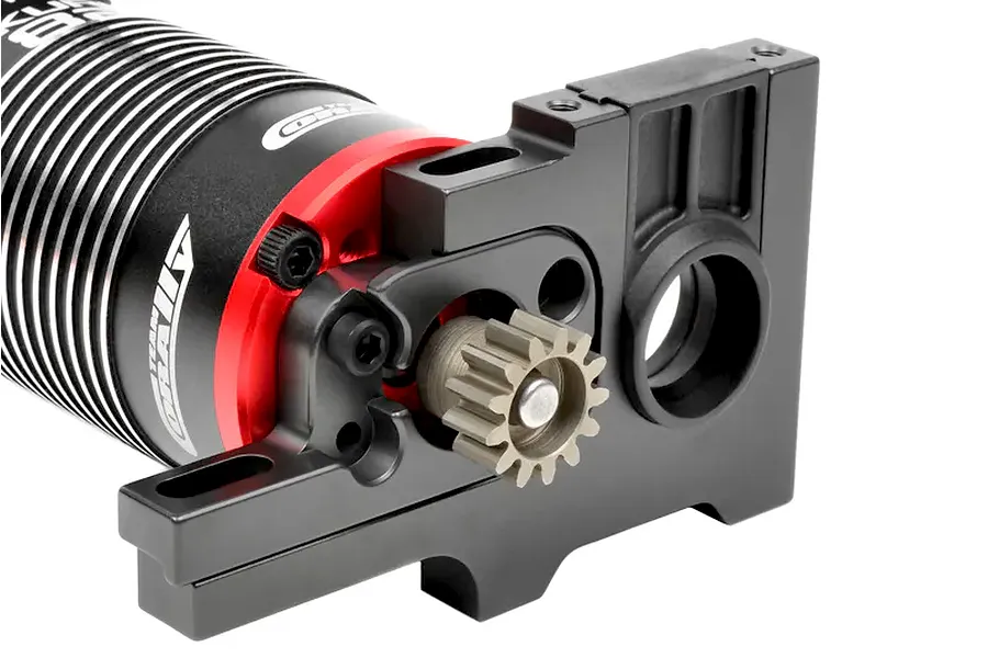 Team Corally electric motor mounted to a black aluminum motor mount assembly with a pinion gear installed against a white background.
