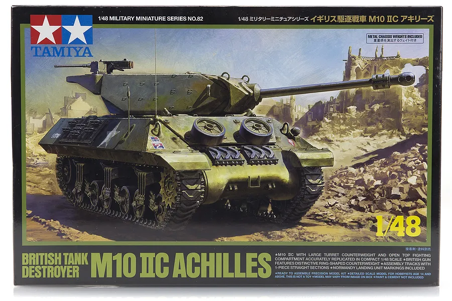 Tamiya 1/48 scale British M10 IIC Achilles tank destroyer plastic model kit box art showing a painted tank in a war-torn landscape.