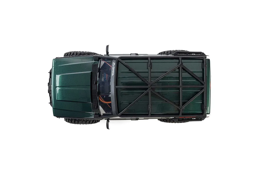 Top-down studio view of the green Axial SCX10 III Jeep Cherokee XJ RC rock crawler highlighting its roof rack.