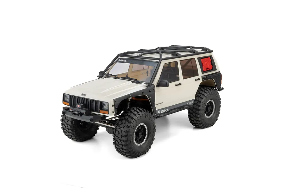 Studio product photo of the white Axial SCX10 III Jeep Cherokee XJ 1/10 scale 4WD electric RC rock crawler.