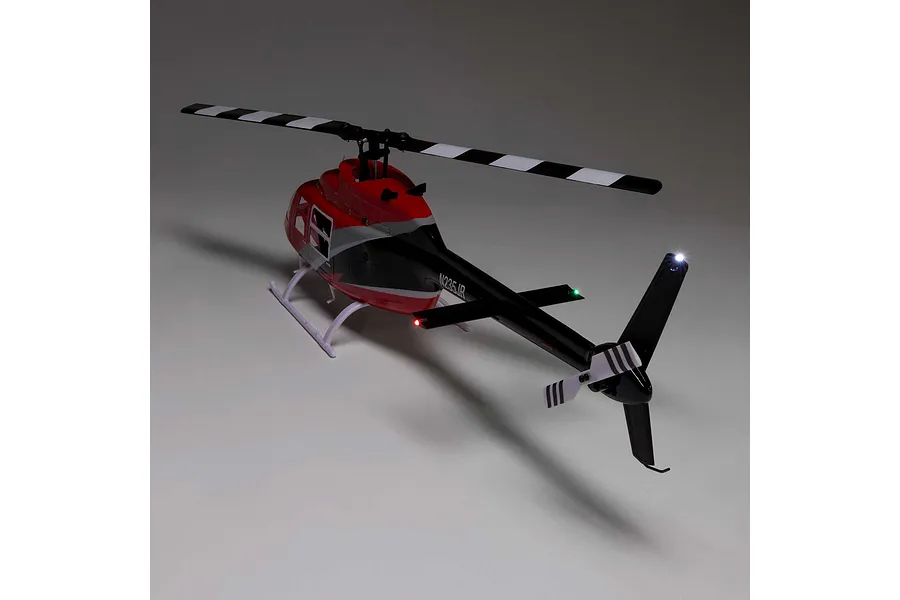 Blade Jet Ranger 235CP RC Helicopter shown from a rear diagonal angle on a neutral grey background with illuminated lights.