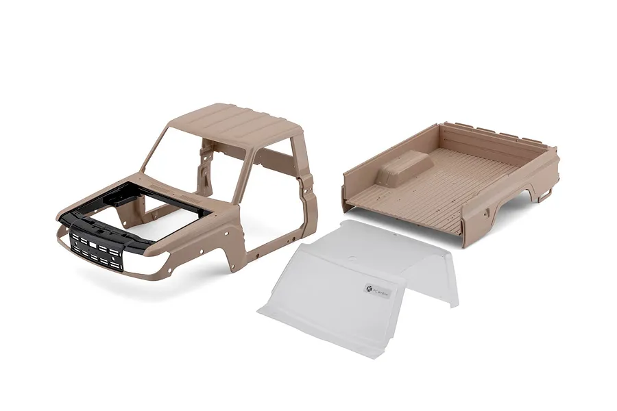 Killerbody 1/10 Toyota Land Cruiser 70 hard body kit in gloss desert yellow, showing cab, truck bed, and clear window piece.