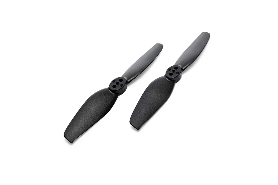 Two black plastic RC helicopter tail rotor blades laid out against a plain white background.