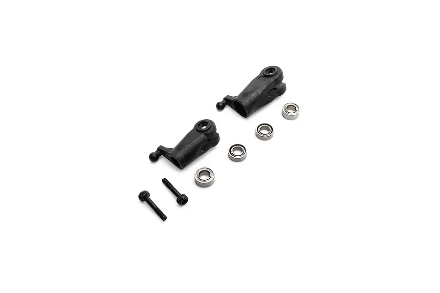 Blade RC helicopter tail rotor grip set including two black plastic grips, four metal bearings, and two screws.