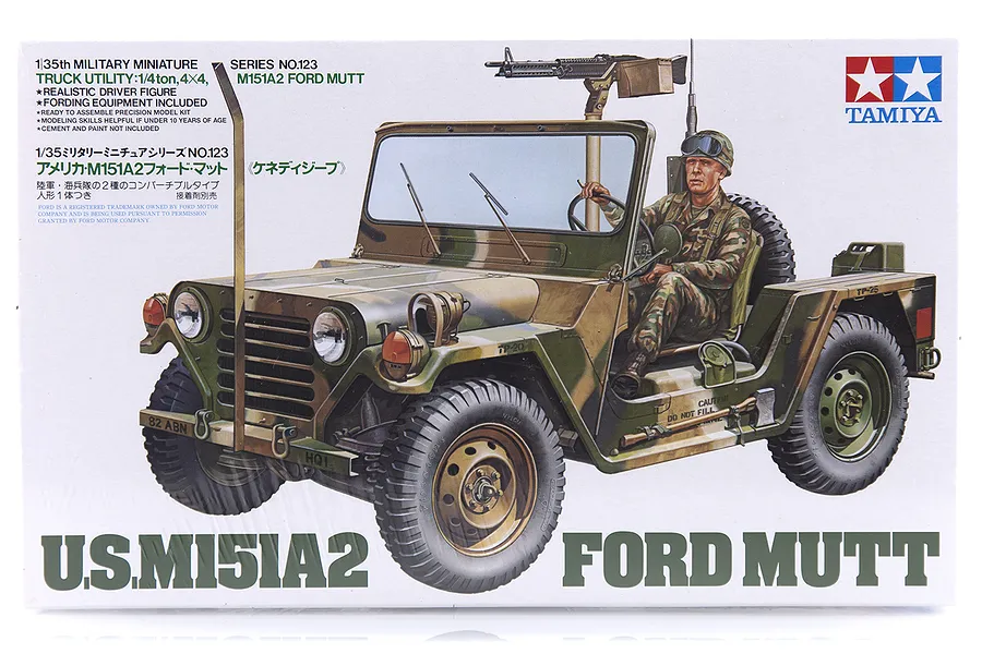 Tamiya 1/35 scale U.S. M151A2 Ford Mutt model kit box art showing a camouflaged military vehicle with a driver and mounted machine gun.