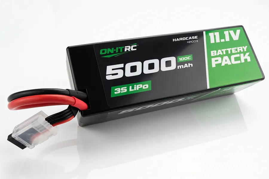 On-It RC 11.1V 5000mAh 100C 3S hard case LiPo battery pack with black case and green and white label against a white background.