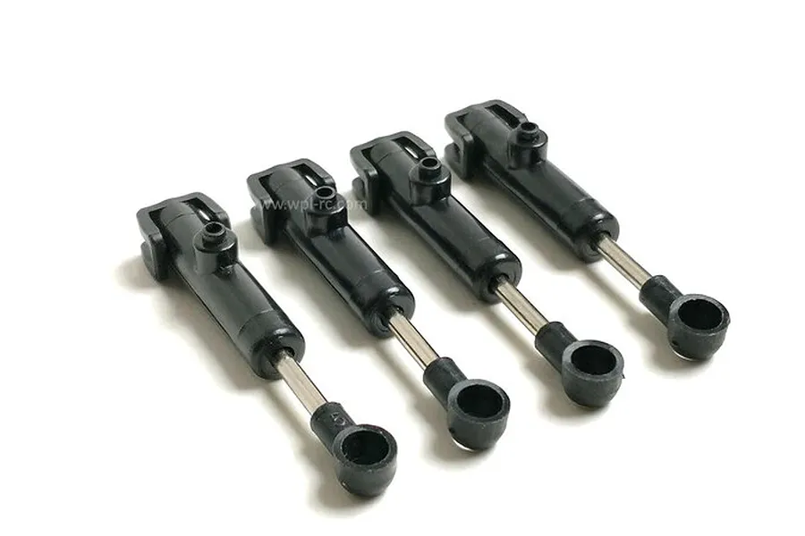 Four black WPL RC shock absorbers laid out on a clean white background.