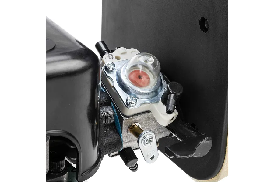 Close-up view of the carburetor and primer bulb on a Losi 35.2cc petrol engine.