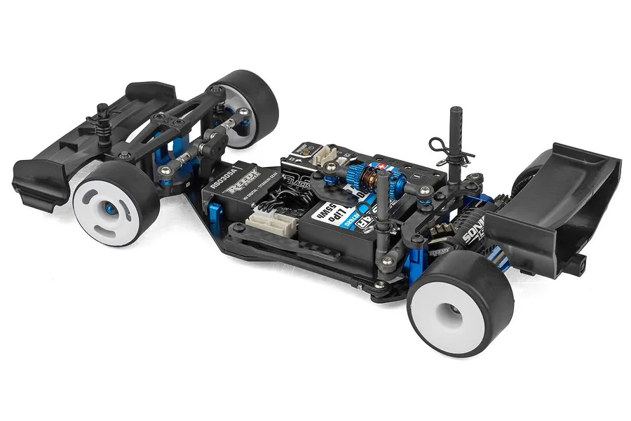 Team Associated RC28F 1/28 scale electric RC car kit chassis viewed from the rear right angle against a plain white background.