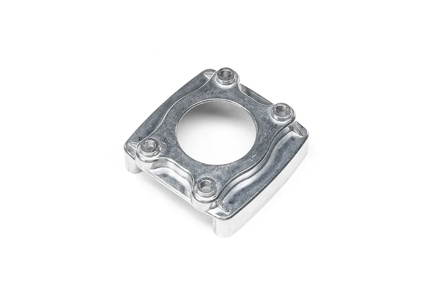 Losi silver metal clutch housing or engine mount part viewed from an angle against a white background.