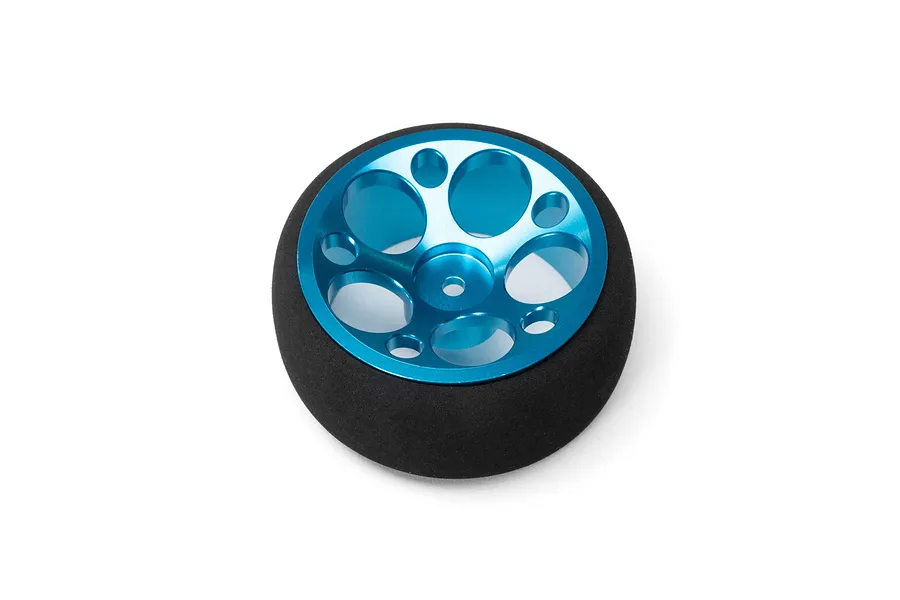 Spektrum wide aluminium wheel and tire assembly featuring a bright blue anodised rim with multiple circular cutouts, set against a plain white background.