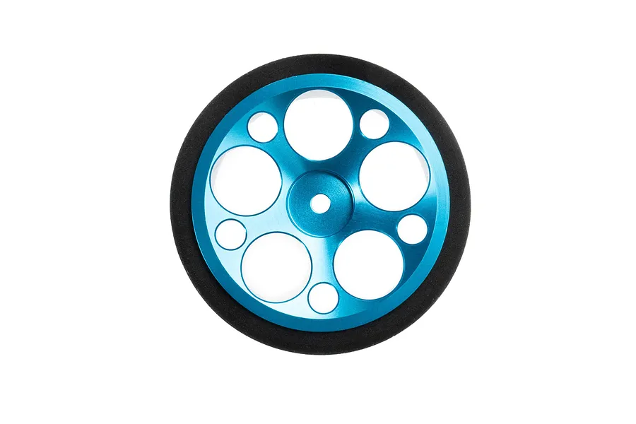 Spektrum wide blue aluminium RC wheel with circular cutout design and black foam tire on a white background.