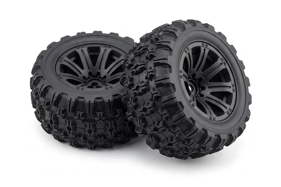 Two black RC truggy wheels and tyres with aggressive tread patterns mounted on multi-spoke rims against a white background.