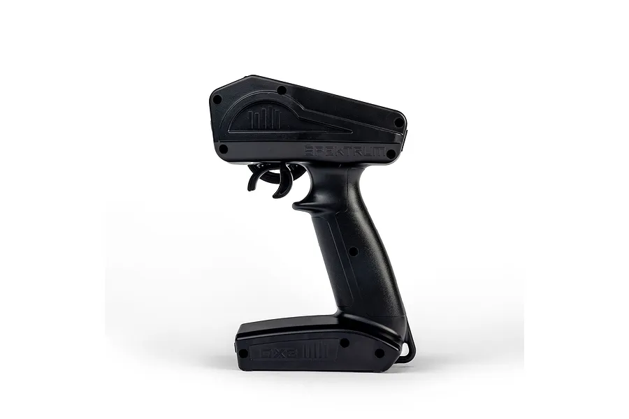 Right profile view of the black plastic handle and trigger assembly of a Spektrum DX3 transmitter against a plain white background.