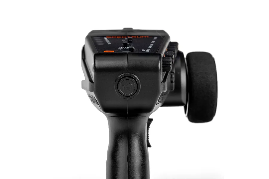 Rear-facing top-down view of the black Spektrum DX3 Smart DSMR transmitter showing the steering wheel on the right and control dials.