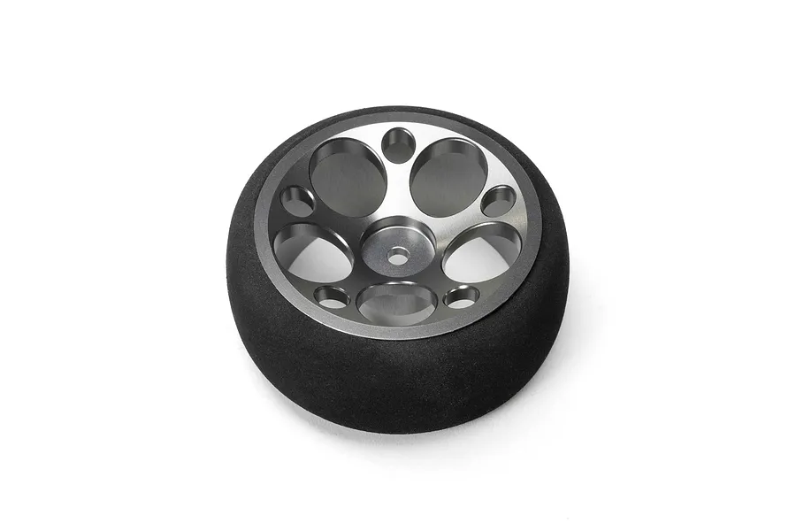 Spektrum aluminium wide circle transmitter wheel in gunmetal grey with a black foam grip on a white background