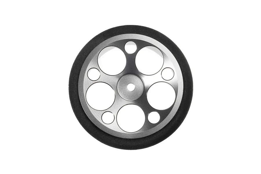 Spektrum gunmetal grey aluminium wide circle transmitter wheel with foam grip isolated on white background.