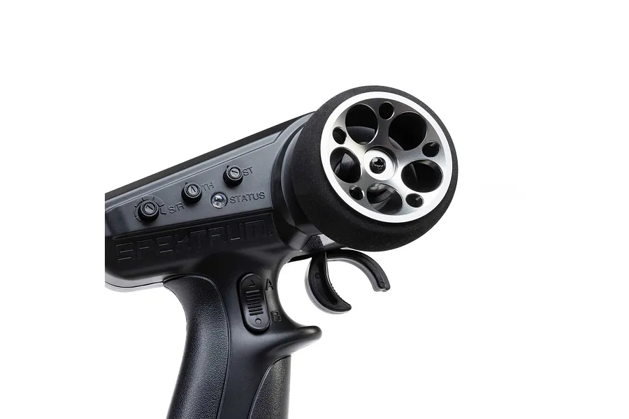 Spektrum aluminium wide circle transmitter wheel in gunmetal grey mounted on an RC transmitter handle against a white background.