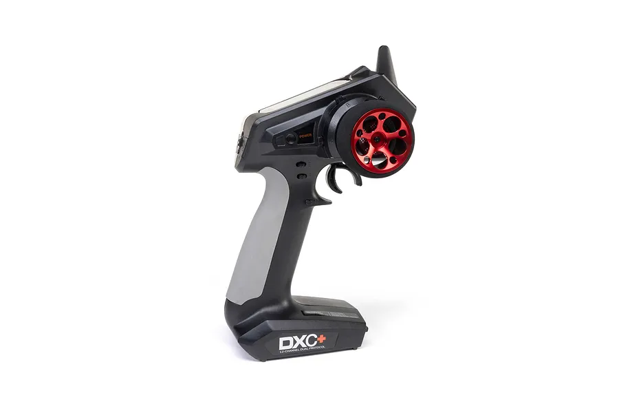 Spektrum DXC+ surface radio transmitter fitted with a red aluminium wide circle steering wheel against a white background.