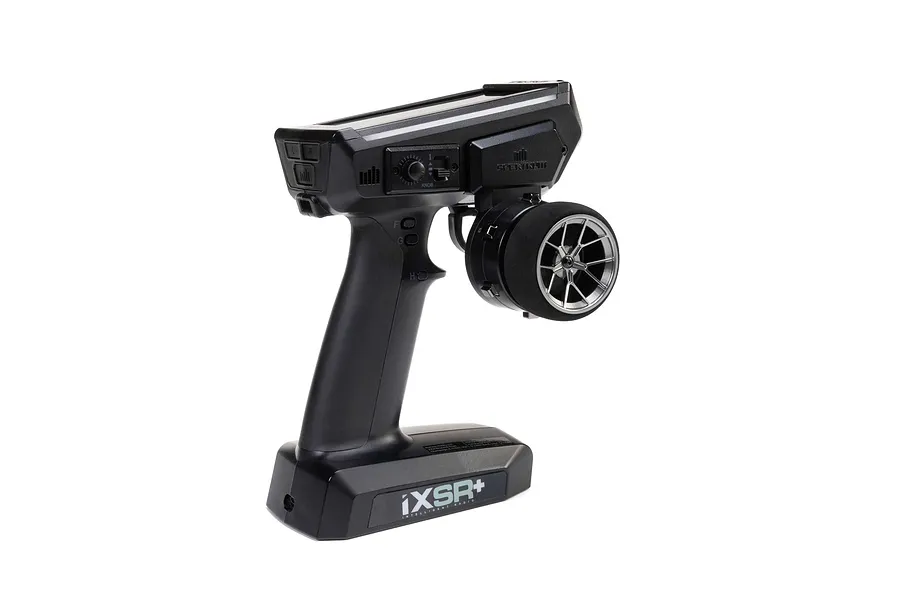 Spektrum RC transmitter featuring an installed gunmetal grey aluminium wide spoke steering wheel against a white background.
