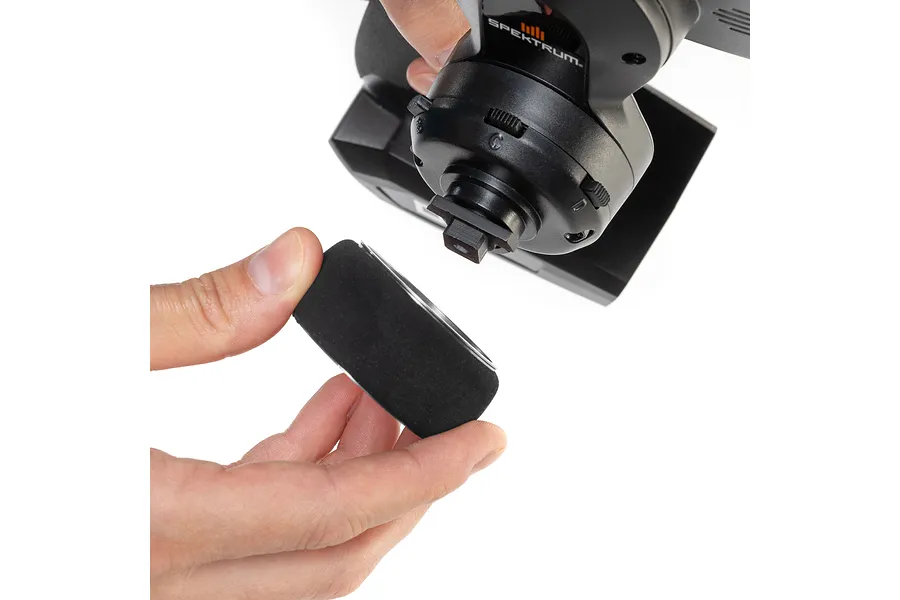 Person holding a Spektrum aluminium wide spoke transmitter wheel ready for installation on an RC transmitter.