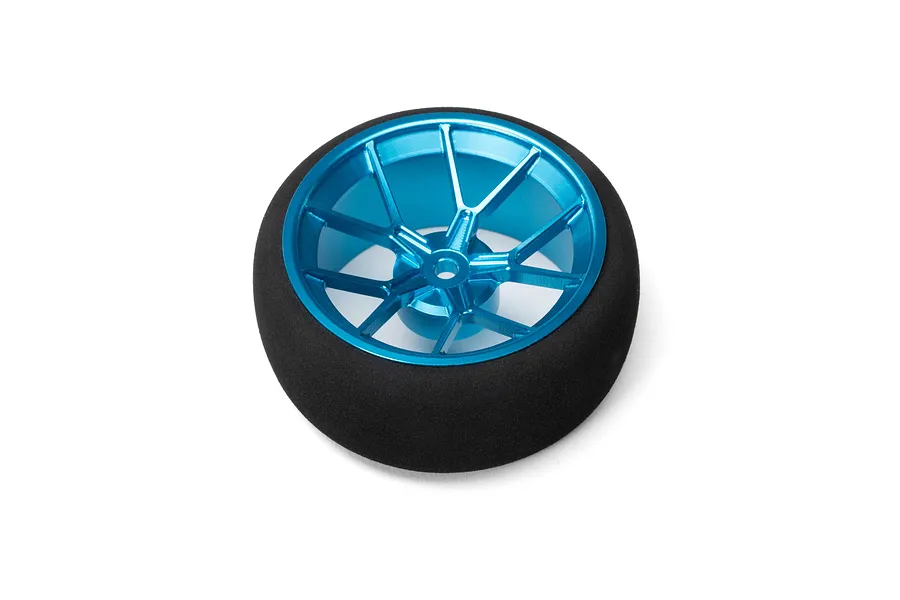 Spektrum aluminium wide spoke transmitter wheel in blue with a black foam grip on a white background.