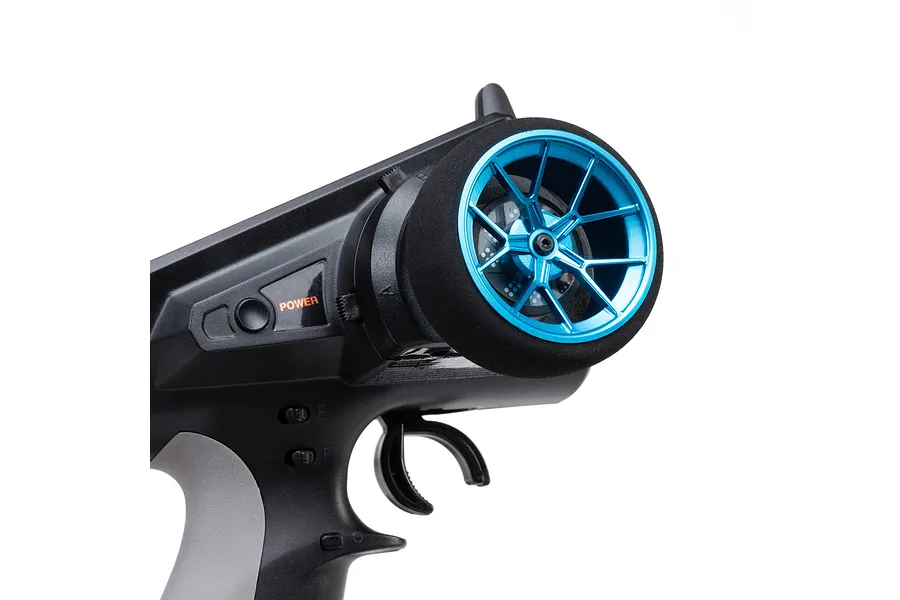 Spektrum blue aluminium wide spoke transmitter wheel installed on an RC radio controller against a white background.