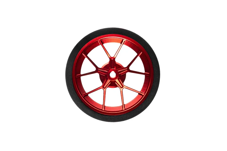 Spektrum red aluminium wide spoke transmitter wheel with a black foam grip isolated on white.