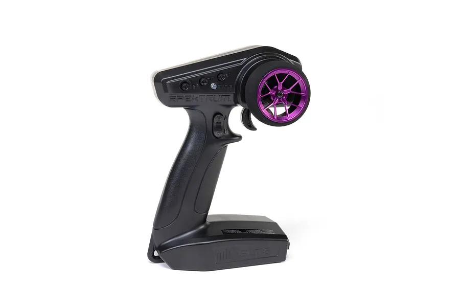 Spektrum RC transmitter fitted with an aftermarket purple wide spoke aluminium steering wheel on a white background.