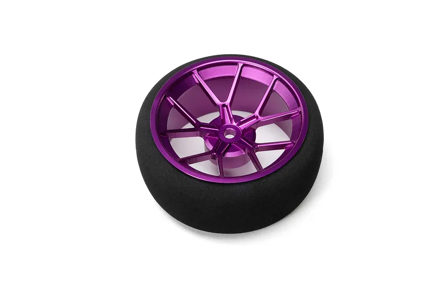 Purple anodized aluminum wide spoke transmitter wheel with a black foam grip isolated on a white background.