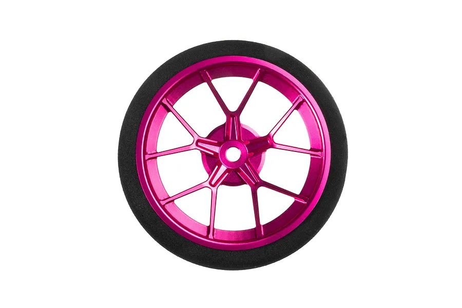 Front-facing studio shot of a pink aluminium wide spoke transmitter wheel with a black foam grip.