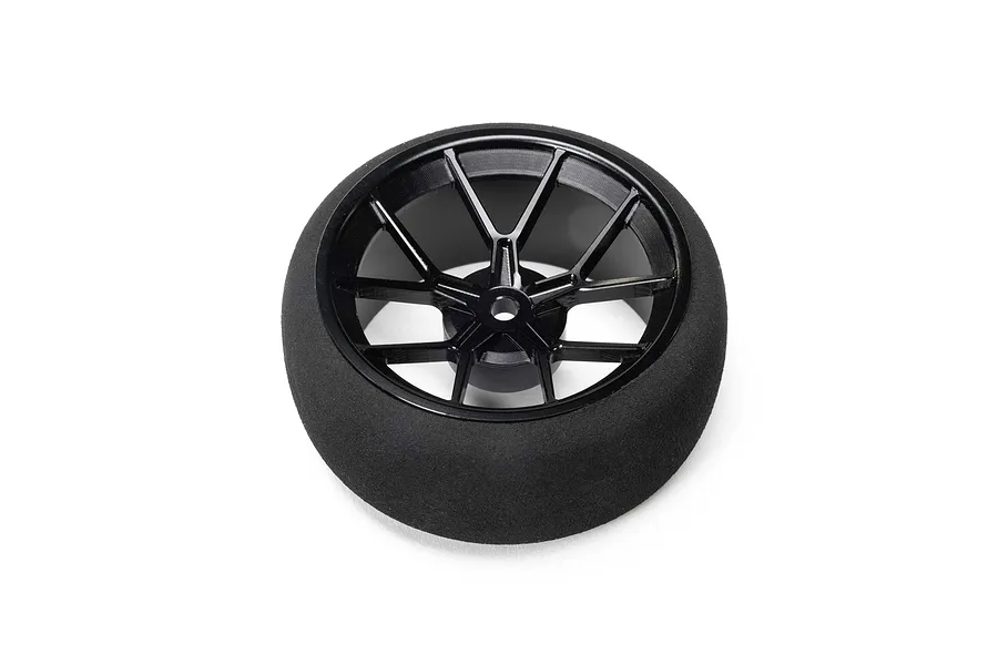 Spektrum black aluminium wide spoke transmitter wheel with a foam tyre against a white background.