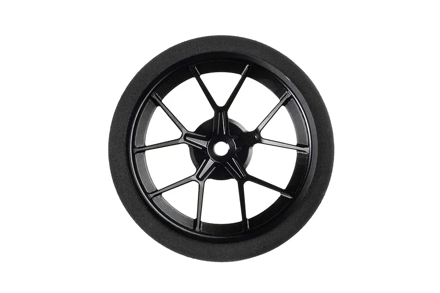 Spektrum black aluminium wide spoke transmitter steering wheel with foam grip against a plain white background.