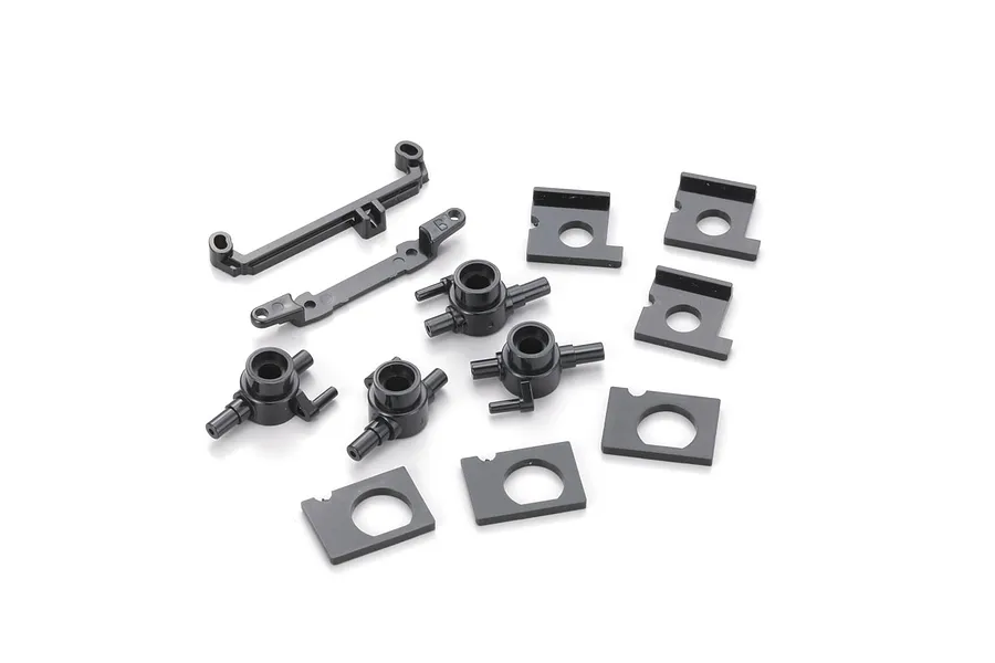 Kyosho Hubs and Motor Mount Set showing molded plastic parts including hubs and brackets on a white background.