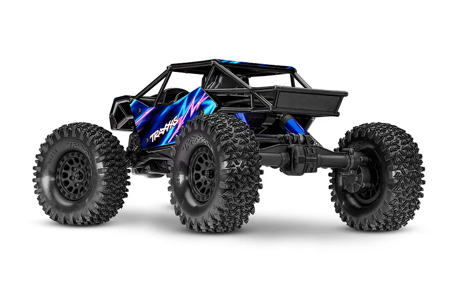 Rear three-quarter studio shot of the Traxxas TXC-4M RC rock crawler with blue and pink panels and black roll cage.