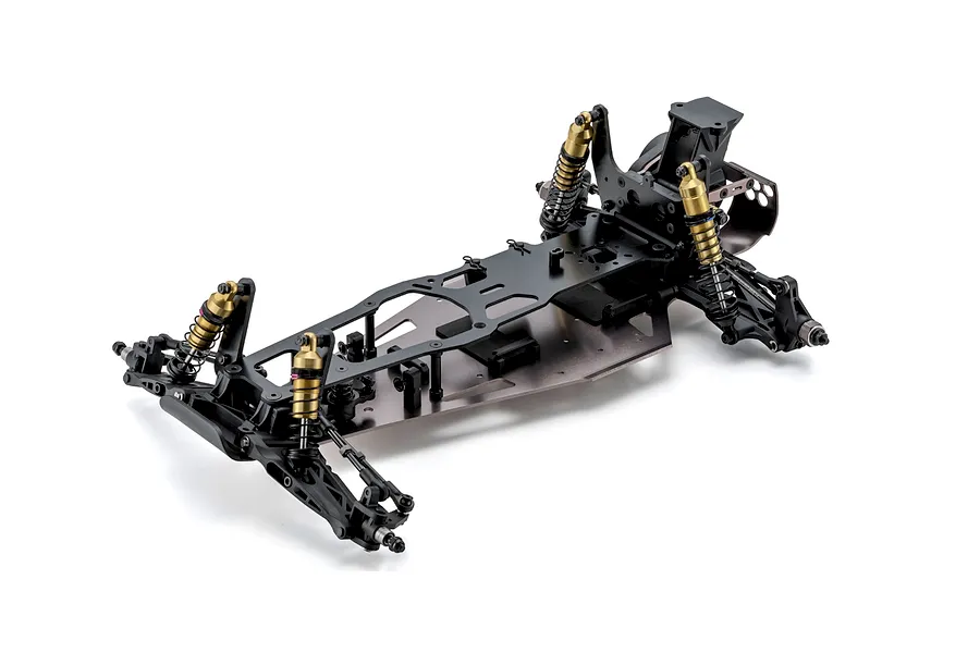 Studio shot of the Kyosho Ultima Pro 1/10 scale 2WD RC buggy unpainted chassis kit showing suspension and shocks.