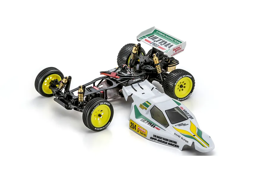 Kyosho Ultima Pro 1/10 scale 2WD electric RC buggy kit shown with chassis, black electronics, yellow wheels, and separate white body shell.